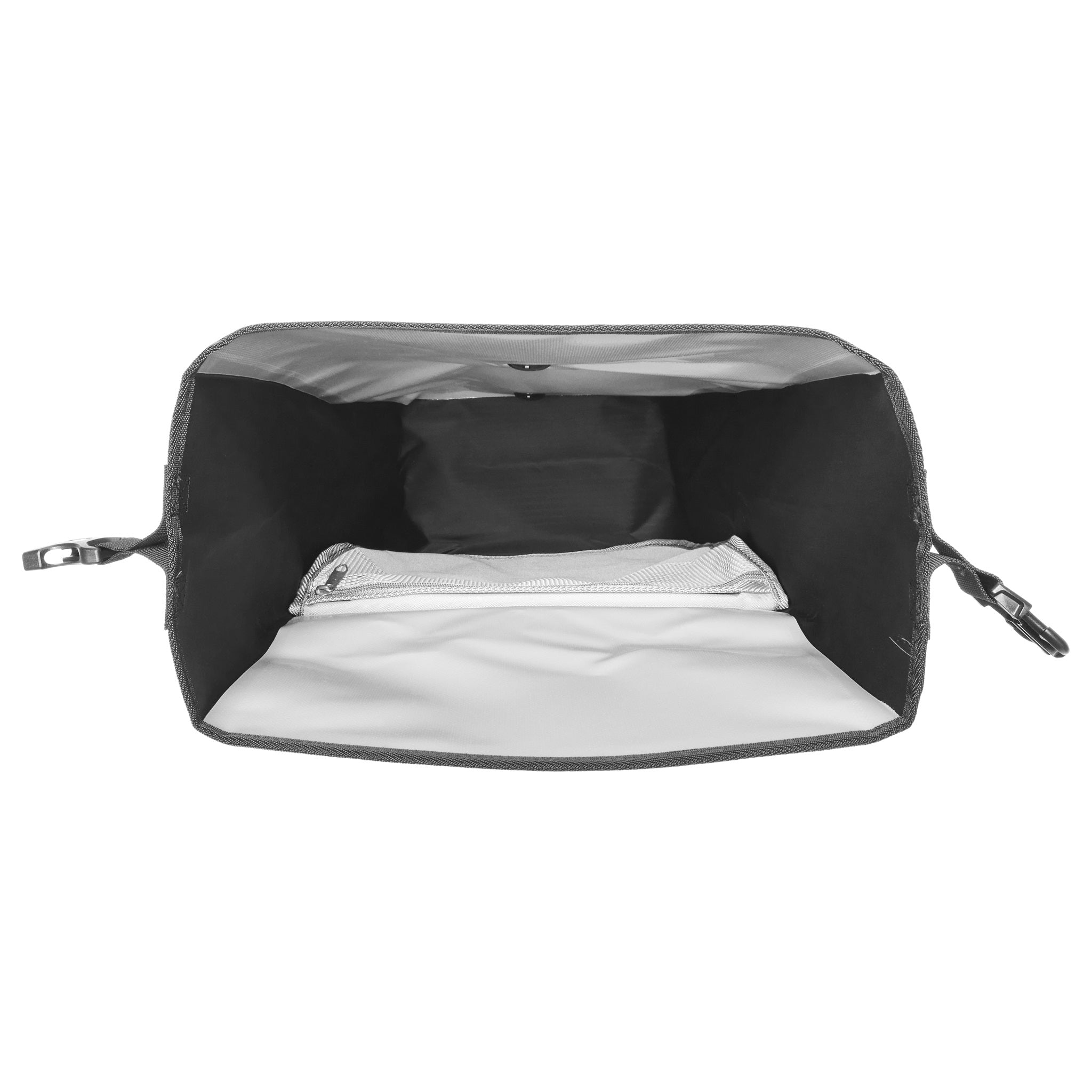 Inside view of ORTLIEB Back-Roller Design bag in design "Morning Routine" with mesh pocket and zipper